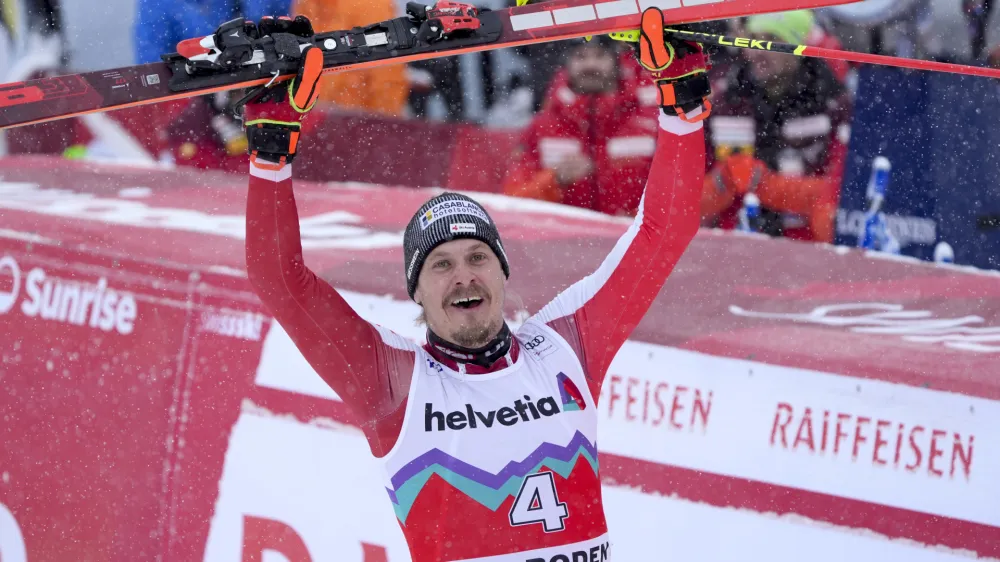Austria's Manuel Feller celebrates winning an alpine ski, men's World Cup slalom race, in Adelboden, Switzerland, Sunday, Jan. 7, 2024. (AP Photo/Giovanni Auletta)