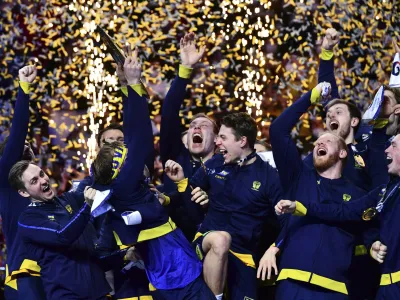 ﻿Swedish players celebrate their victory at the end of the Men's European Handball Championship final match between Sweden and Spain, in Budapest, Hungary, Sunday, Jan. 30, 2022. (AP Photo/Anna Szilagyi)