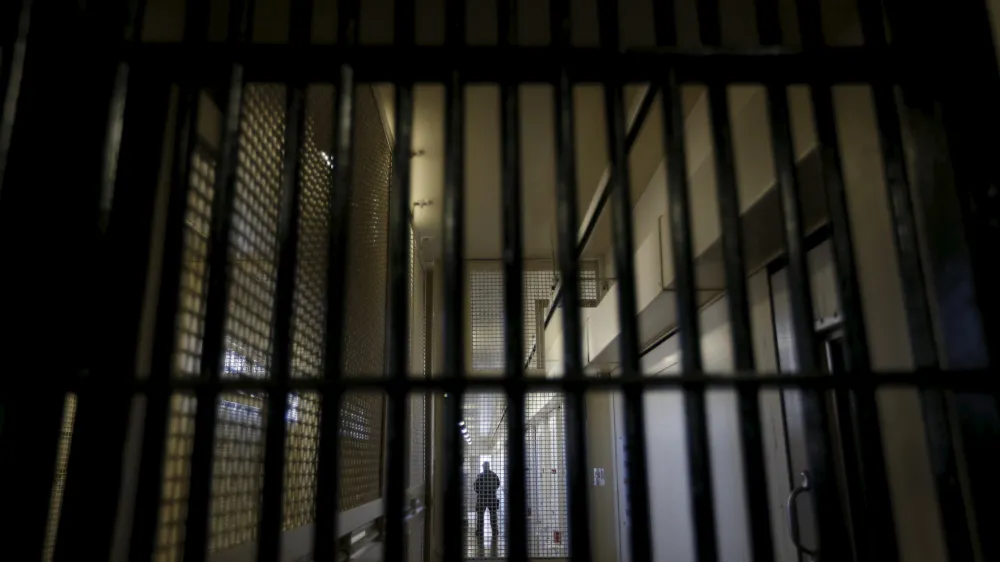 ﻿A guard stands behind bars at the Adjustment Center during a media tour of California's Death Row at San Quentin State Prison in San Quentin, California December 29, 2015. America's most populous state, which has not carried out an execution in a decade, begins 2016 at a pivotal juncture, as legal developments hasten the march toward resuming executions, while opponents seek to end the death penalty at the ballot box. To match Feature CALIFORNIA-DEATH-PENALTY/  Picture taken December 29, 2015. REUTERS/Stephen Lam - RTX21EDY