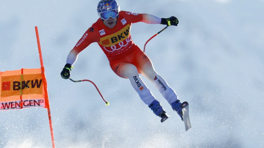 Switzerland's Marco Odermatt is airborne during an alpine ski, men's World Cup downhill race, in Wengen, Switzerland, Thursday, Jan. 11, 2024. (AP Photo/Alessandro Trovati)