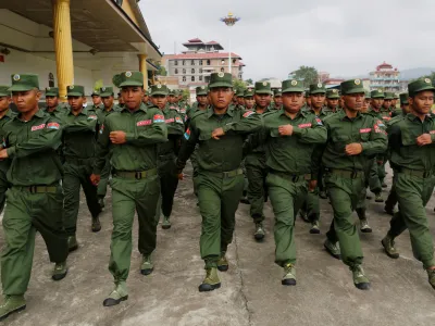 FILE PHOTO: United Wa State Army (UWSA) soldiers march during a display for the media in Pansang, Wa territory in north east Myanmar October 4, 2016. Picture taken October 4, 2016. REUTERS/Soe Zeya Tun/File Photo