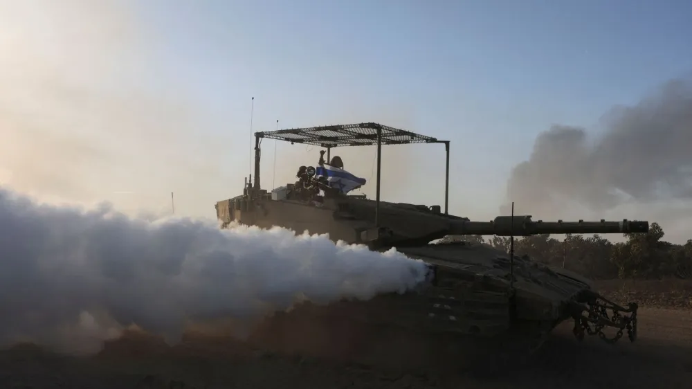 Israeli soldiers patrol in a tank, amid the ongoing conflict between Israel and the Palestinian Islamist group Hamas, near Israel's border with Gaza, southern Israel January 21, 2024. REUTERS/Ronen Zvulun   TPX IMAGES OF THE DAY