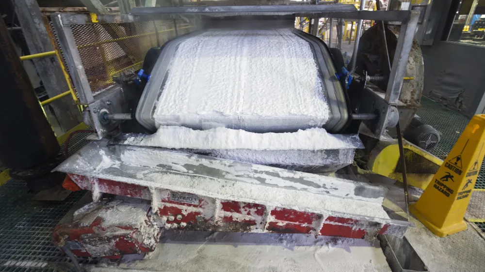 FILE - Technical grade lithium carbonate comes off a conveyor belt during a tour of the Silver Peak lithium mine on Jan. 30, 2017, near Tonopah, Nev. In an announcement Monday, Feb. 27, 2023, the U.S. Department of Energy will provide $375 million in loans to a battery recycling company to build its first, and one of the first, lithium ion battery recycling plants in North America. The DOE announcement came within hours of another announcement by American Battery Technology Company that it has discovered one of the largest known lithium deposits in the U.S. at Tonopah Flats. (Steve Marcus/Las Vegas Sun via AP)