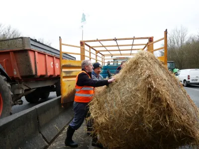 French farmers block the A16 highway with their tractors and hay bales to protest over price pressures, taxes and green regulation, grievances that are shared by farmers across Europe, near Beauvais, France, January 23, 2024. REUTERS/Abdul Saboor