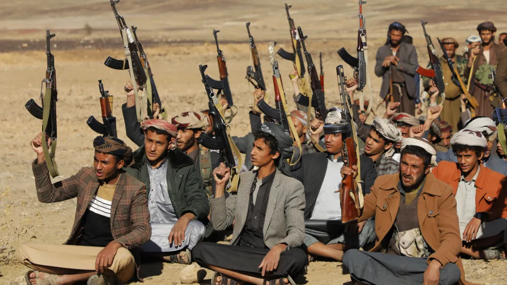 22 January 2024, Yemen, Sanaa: Tribal supporters of Yemen's Houthis hold up their weapons during armed a protest against the US government designating Houthis as a terror group in Sanaa. Photo: Osamah Yahya/ZUMA Press Wire/dpa