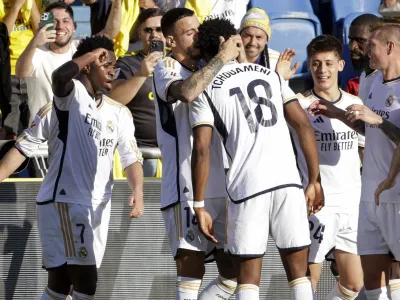 Real Madrid's Aurelien Tchouameni celebrates scoring his side's second goal during a Spanish La liga soccer match between Las Palmas and Real Madrid at the Gran Canaria stadium on the Canary island of Las Palmas, Spain, Saturday, Jan. 27, 2024. (AP Photo/Gerardo Ojeda)