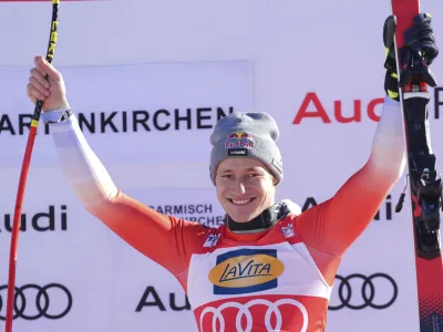 The winner Switzerland's Marco Odermatt celebrates after an alpine ski, men's World Cup super G race, in Garmisch-Partenkirchen, Germany, Sunday, Jan. 28, 2024. (AP Photo/Giovanni Auletta)