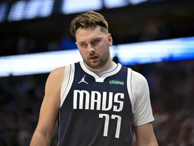 Jan 27, 2024; Dallas, Texas, USA; Dallas Mavericks guard Luka Doncic (77) walks back on to the court during the second quarter against the Sacramento Kings at the American Airlines Center. Mandatory Credit: Jerome Miron-USA TODAY Sports