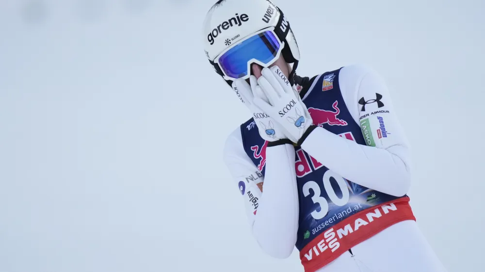 Timi Zajc, of Slovenia, reacts after his final round jump of the ski flying world championships, at the Kulmkogel mountain in Bad Mitterndorf, Austria, Saturday, Jan. 27, 2024. (AP Photo/Matthias Schrader)