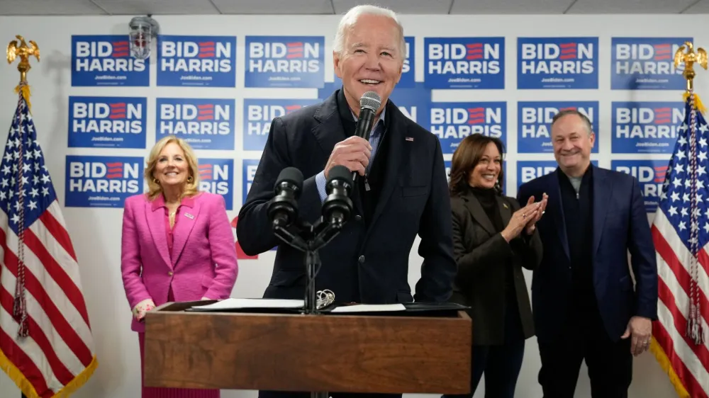 U.S. President Joe Biden speaks next to first lady Jill Biden, Vice President Kamala Harris and second gentleman Doug Emhoff during the opening of the Biden for President campaign office in Wilmington, Delaware, U.S., February 3, 2024. REUTERS/Joshua Roberts