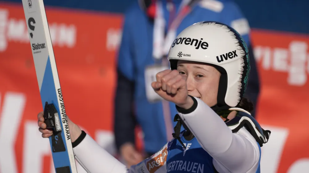 Slovenia's Nika Prevc celebrates at the finish area during the Women's Normal Hill Individual Ski Jumping World Cup event in Villach, Austria, Wednesday, Jan. 3, 2024. (AP Photo/Darko Bandic)