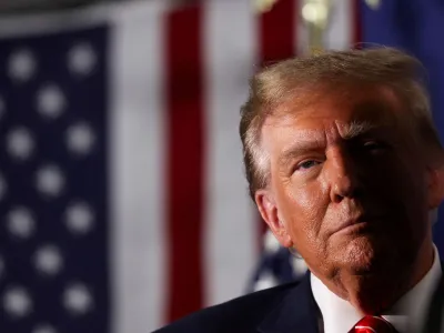FILE PHOTO: Former U.S. President and Republican presidential candidate Donald Trump attends a rally in advance of the New Hampshire primary election in Laconia, New Hampshire, U.S. January 22, 2024. REUTERS/Mike Segar/File Photo