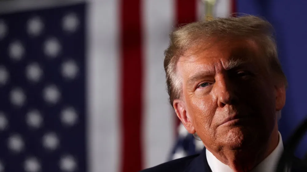 FILE PHOTO: Former U.S. President and Republican presidential candidate Donald Trump attends a rally in advance of the New Hampshire primary election in Laconia, New Hampshire, U.S. January 22, 2024. REUTERS/Mike Segar/File Photo