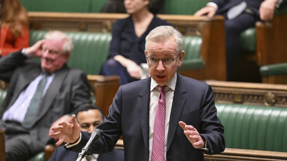 In this photo issued by UK Parliament, Communities Secretary Michael Gove makes a statement to MPs in the House of Commons, London, Thursday March 14, 2024, where he set out the the Government's new definition of extremism. The British government has published a new official definition of "extremism." Groups that get the label will be barred from receiving government funding. The move is in response to a surge in reports of antisemitism and anti-Muslim hate speech and what authorities call an increase in radicalization in Britain since Hamas' Oct. 7 attack on Israel, which triggered the war and Israel's invasion of Gaza. (Maria Unger/UK Parliament via AP)