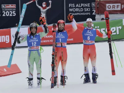 Alpine Skiing - FIS Alpine Ski World Cup - Men's Giant Slalom - Saalbach, Austria - March 16, 2024 Switzerland's Loic Meillard celebrates after winning the men's giant slalom along with second placed Andorra's Joan Verdu and third placed Switzerland's Thomas Tumler REUTERS/Leonhard Foeger