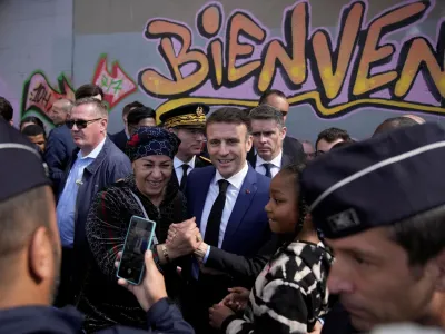 French President Emmanuel Macron meets residents during a visit focusing on security and the fight against drug trafficking, in La Castellane district of Marseille, southern France March 19, 2024.   Christophe Ena/Pool via REUTERS