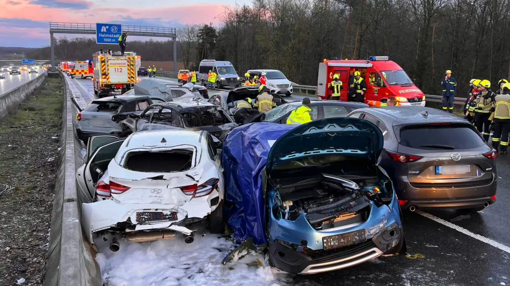 24 March 2024, Bavaria, Uettingen: A view of the scene of an accident involving some 40 vehicles near Wuerzburg, in Germany's Bavaria region, where two people were killed and 27 others were injured after a pile-up. Photo: Merzbach/News5/dpa - ACHTUNG: Kennzeichen wurde(n) aus rechtlichen Gründen gepixelt