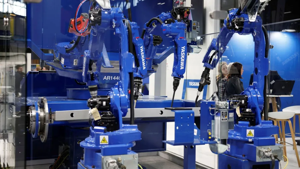 Yaskawa industrial robots are displayed at the Global Industrie exhibition in Villepinte near Paris, France, March 26, 2024. REUTERS/Benoit Tessier