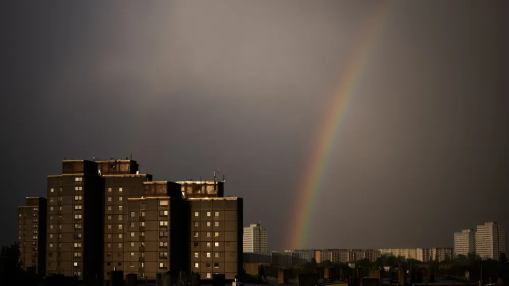 A rainbow appears in the sky over residents buildings in the German capital during a thunderstorm in Berlin, Tuesday, April 16, 2024. (AP Photo/Markus Schreiber)