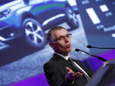 ﻿PSA Peugeot Citroen Chief Executive Carlos Tavares delivers his speech during the presentation of the company's 2016 full year results, in Paris, Thursday, Feb.23, 2017. French carmaker PSA Group saw its profits jump last year and is giving dividends for the first time since 2011, burnishing its image as it weighs a buyout of General Motors' money-losing European operations. (AP Photo/Christophe Ena)