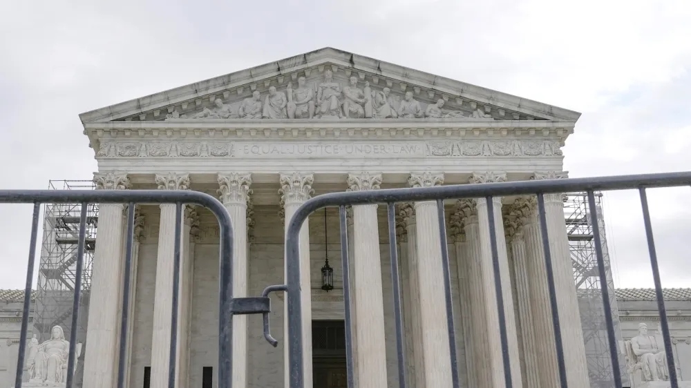The Supreme Court is seen during a protest outside the as the justices prepare to hear arguments over whether Donald Trump is immune from prosecution in a case charging him with plotting to overturn the results of the 2020 presidential election, on Capitol Hill Thursday, April 25, 2024, in Washington. (AP Photo/Mariam Zuhaib)