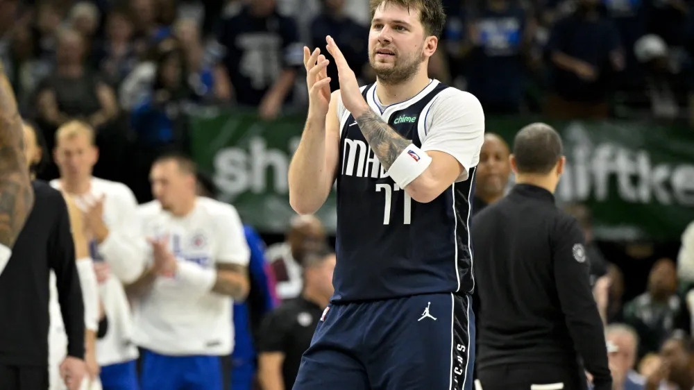Apr 26, 2024; Dallas, Texas, USA; Dallas Mavericks guard Luka Doncic (77) celebrates during the fourth quarter against the LA Clippers during game three of the first round for the 2024 NBA playoffs at the American Airlines Center. Mandatory Credit: Jerome Miron-USA TODAY Sports
