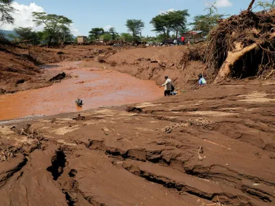 Residents gather at the riverbed as they search for missing people after heavy flash floods wiped out several homes when a dam burst, following heavy rains in Kamuchiri village of Mai Mahiu, Nakuru County, Kenya April 29, 2024. REUTERS/Thomas Mukoya