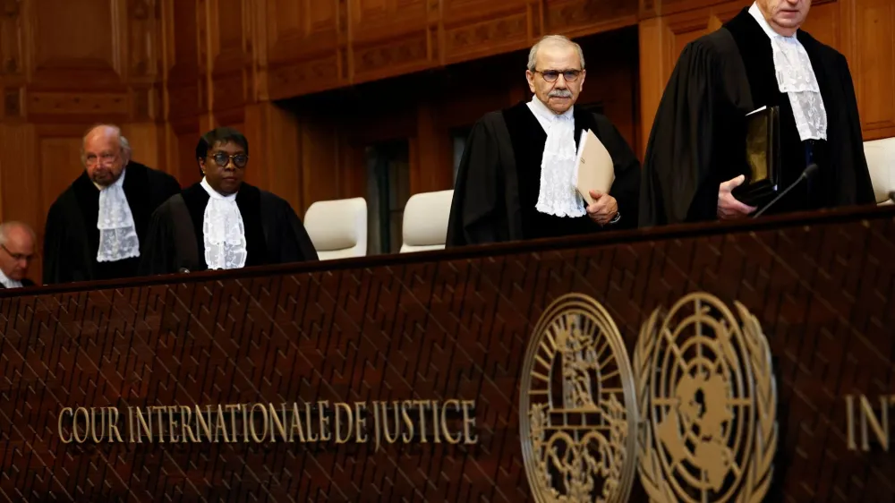 Judge Nawaf Salam, president of the International Court of Justice (ICJ), and other judges walk as they attend a public hearing where Mexico is set to ask the International Court of Justice (ICJ) to issue emergency measures against Ecuador over the armed raid on the Mexican embassy, which Mexico says is a violation of international law, in The Hague, Netherlands, April 30, 2024. REUTERS/Piroschka van de Wouw