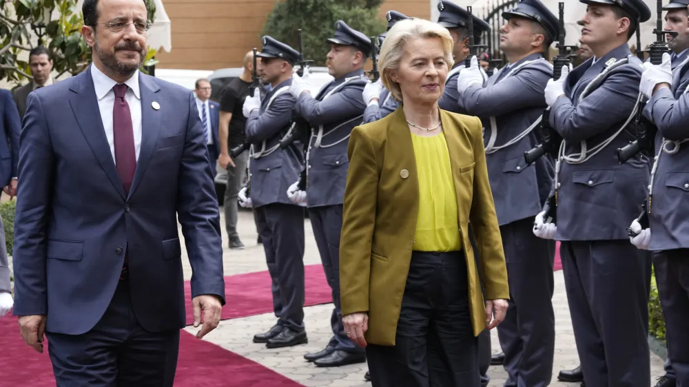 President of the European Commission Ursula von der Leyen, right, and Cyprus' President Nikos Christodoulides, left, review the honor guard upon their arrival for a meeting with Lebanese Parliament Speaker Nabih Berri, in Beirut, Thursday, May 2, 2024. The European Union announced Thursday a 1 billion euro aid package for Lebanon, much of which will go to strengthening border control to halt the flow of asylum seekers and migrants from the small, crisis-racked country across the Mediterranean sea to Cyprus and Italy. (AP Photo/Hussein Malla)