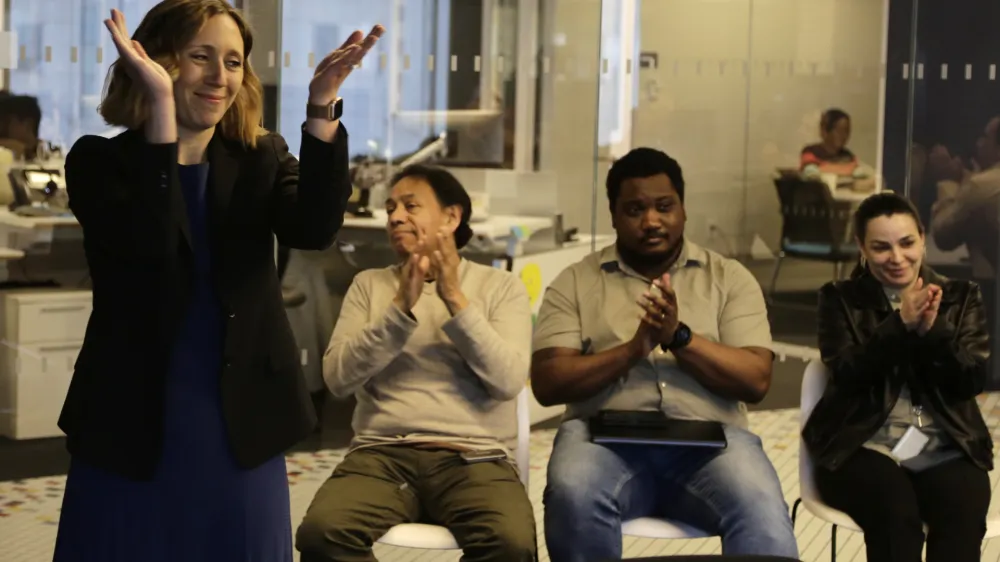 Executive Editor Julie Pace, left, reacts on Monday, May 6, 2024, in New York after it was announced that the Associated Press won the Pulitzer Prize for Feature Photography. Along with honoring winners and finalists in 15 journalism categories, the Pulitzer Board also recognizes distinguished work in areas including books, music and theater. (AP Photo/Peter Morgan)