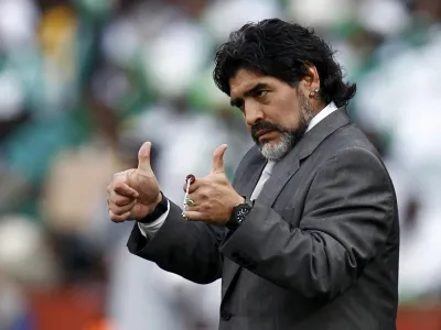 Argentina's coach Diego Maradona gives the thumbs-up during a 2010 World Cup Group B soccer match against Nigeria at Ellis Park stadium in Johannesburg June 12, 2010. REUTERS/Eddie Keogh (SOUTH AFRICA - Tags: SPORT SOCCER WORLD CUP)