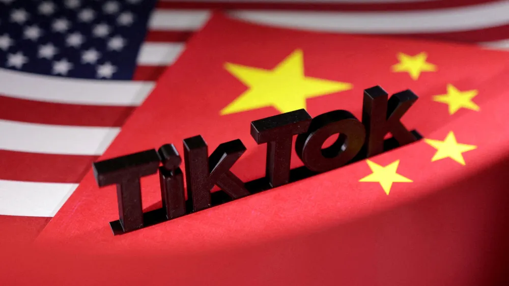 FILE PHOTO: TikTok logo is placed on the U.S. and Chinese flags in this illustration taken, April 25, 2024. REUTERS/Dado Ruvic/Illustration/File Photo