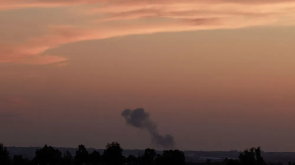 Smoke billows as an Israeli military vehicle fires near the Israel-Gaza border, amid the ongoing conflict between Israel and the Palestinian Islamist group Hamas, in southern Israel, May 8, 2024. REUTERS/Ammar Awad