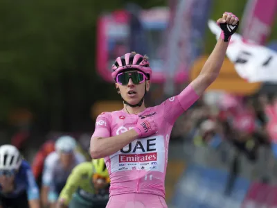 Slovenia's Pogacar Tadej celebrates winning the 8th stage of the Giro d'Italia cycling race, from Spoleto to Prati di Tivo, Italy, Saturday, May 11 2024 Italy. (Gian Mattia D'Alberto/LaPresse via AP)
