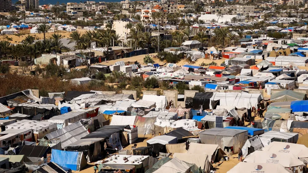 Displaced Palestinians, who fled their houses due to Israeli strikes, shelter at a tent camp, amid the ongoing conflict between Israel and the Palestinian Islamist group Hamas, in Rafah in the southern Gaza Strip, February 29, 2024. REUTERS/Ibraheem Abu Mustafa