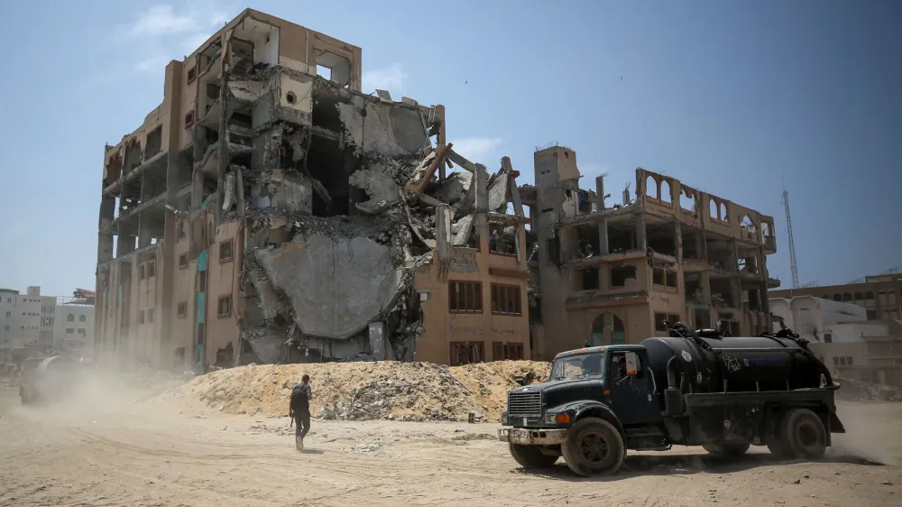 A truck moves pas the Islamic University of Gaza (IUG), which was destroyed during Israel's military offensive, amid the ongoing conflict between Israel and the Palestinian Islamist group Hamas, in Gaza City April 28, 2024. REUTERS/Dawoud Abu Alkas