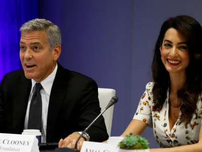 FILE PHOTO - Actor George Clooney and his wife Amal attend a CEO roundtable at the United Nations during the United Nations General Assembly in New York, U.S. on September 20, 2016. REUTERS/Kevin Lamarque/File Photo