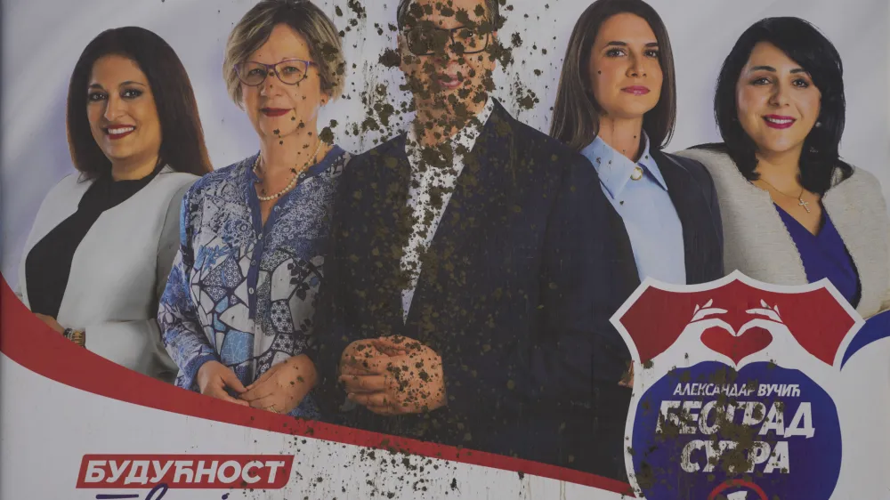 A vandalized pre-election billboard showing Serbian President Aleksandar Vucic, center, with associates, reading: "The future is in your hands" in Belgrade, Serbia, Thursday, May 30, 2024, ahead of the municipal vote set for June 2. Voters in Serbia go to the polls this weekend in a municipal election for dozens of cities and towns, including a rerun vote in the capital Belgrade where ruling populists were accused of a fraud at a previous vote in December. The right-wing Serbian Progressive Party of President Aleksandar Vucic is seen as a favorite ahead of the Sunday balloting which could further secure the strongman's already vast hold on power. (AP Photo/Darko Vojinovic)