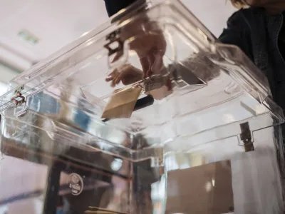 A woman casts her ballot for the European Parliament elections, Sunday, June 9, 2024 in Paris. Polling stations opened across Europe on Sunday as voters from 20 countries cast ballots in elections that are expected to shift the European Union's parliament to the right and could reshape the future direction of the world's biggest trading bloc. (AP Photo/Lewis Joly)