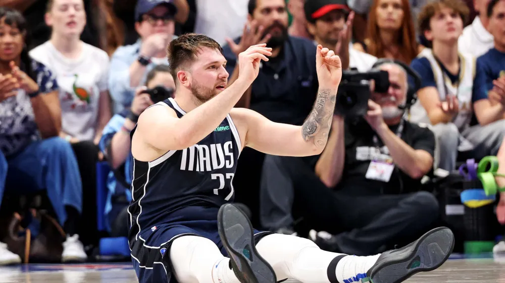 Jun 12, 2024; Dallas, Texas, USA; Dallas Mavericks guard Luka Doncic (77) reacts to receiving his sixth foul during the fourth quarter during game three of the 2024 NBA Finals against the Boston Celtics at American Airlines Center. Mandatory Credit: Kevin Jairaj-USA TODAY Sports
