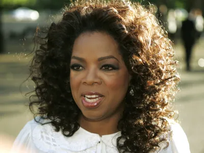 FILE - In this June 25, 2008 file photo, U.S. television presenter Oprah Winfrey arrives for the dinner birthday party of former president of South Africa Nelson Mandela in central London's Hyde Park. Winfrey has settled a defamation lawsuit filed by the ex-headmistress of her girls school in South Africa, lawyers said Tuesday March 23, 2010. The lawsuit by former headmistress Nomvuyo Mzamane claimed Winfrey defamed her in remarks made in the wake of a 2007 sex-abuse scandal at the school. (AP Photo/Lefteris Pitarakis, File)