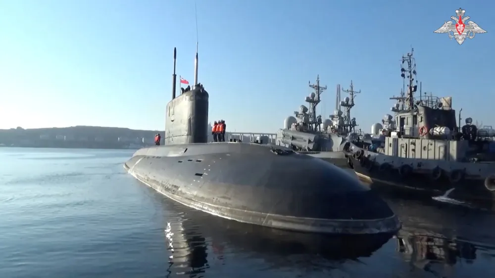 Russian sailors line up onboard a submarine, which is involved in drills held by the Pacific Fleet of the Russian Navy in the waters of the Pacific Ocean, the Sea of Japan and the Sea of Okhotsk, before leaving the port of Vladivostok, Russia, in this still image from video published June 18, 2024. Russian Defence Ministry/Handout via REUTERS ATTENTION EDITORS - THIS IMAGE HAS BEEN SUPPLIED BY A THIRD PARTY. NO RESALES. NO ARCHIVES. MANDATORY CREDIT. WATERMARK FROM SOURCE.