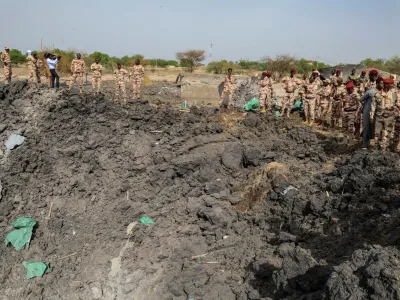 Army officers stand around blast damages after last night's fire that caused blasts at a military ammunition depot in N'Djamena, Chad June 19, 2024. REUTERS/Israel Matene