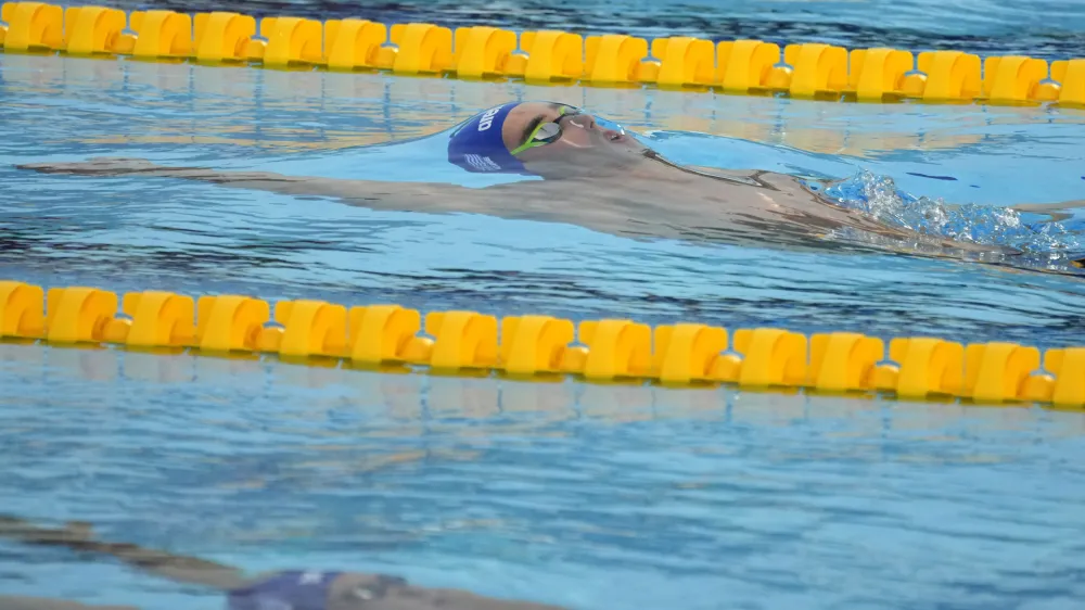 Winner Apostolos Christou of Greece competes during the men's 50m backstroke final at the European Aquatics Championships in Belgrade, Serbia, Friday, June 21, 2024. (AP Photo/Darko Bandic)