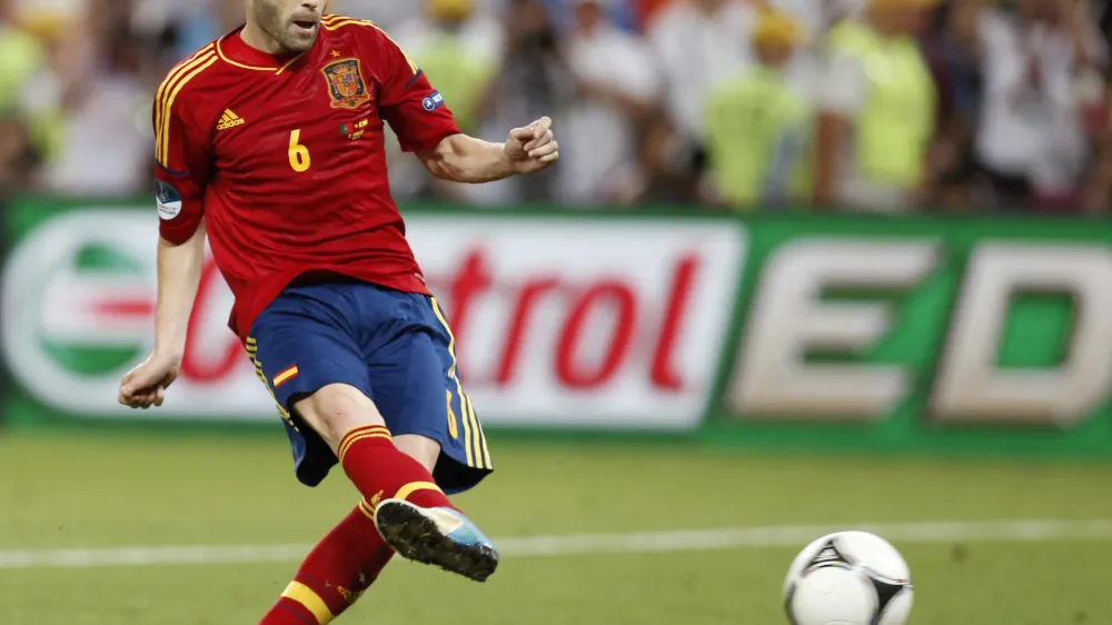 Spain's Andres Iniesta scores his penalty shootout during the Euro 2012 soccer championship semifinal match between Spain and Portugal in Donetsk, Ukraine, Thursday, June 28, 2012. (AP Photo/Jon Super)