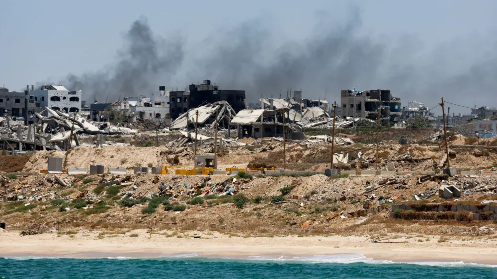 FILE PHOTO: Destroyed buildings are pictured in Gaza, amid the ongoing conflict between Israel and Hamas, as seen near the Gaza coast, June 25, 2024. REUTERS/Amir Cohen/File Photo