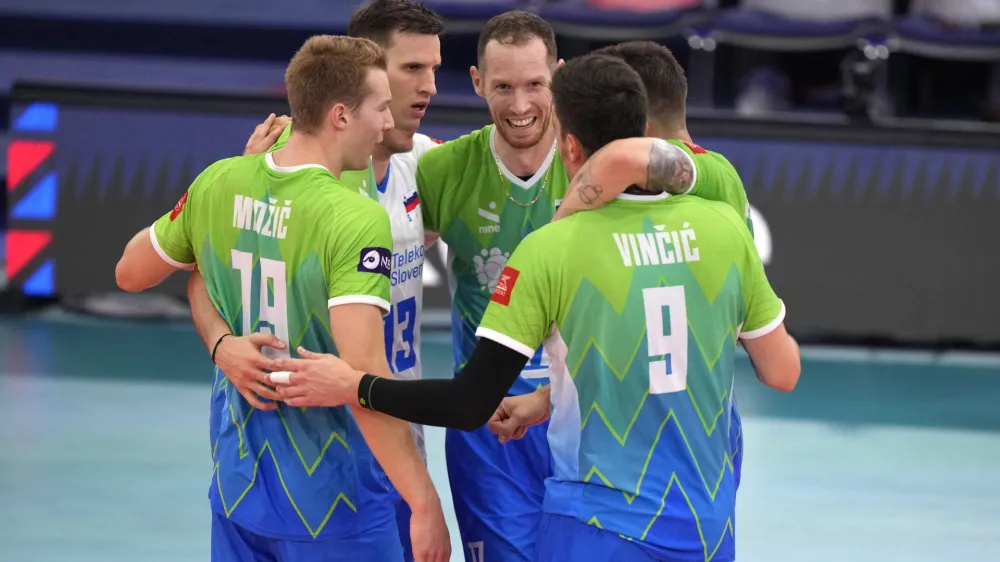 Slovenia team members celebrate winning the firt set during the Men's European Volleyball bronze medal final between France and Slovenia, in Rome, Saturday, Sept. 16, 2023. (AP Photo/Andrew Medichini)