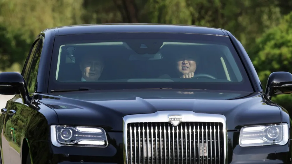 Russia's President Vladimir Putin and North Korea's leader Kim Jong Un ride an Aurus car in Pyongyang, North Korea June 19, 2024. Sputnik/Gavriil Grigorov/Pool via REUTERS ATTENTION EDITORS - THIS IMAGE WAS PROVIDED BY A THIRD PARTY.