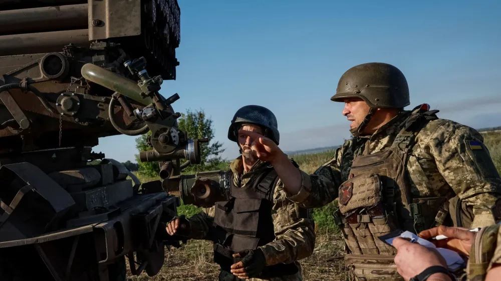 Ukrainian service members of the 110th Colonel-General Marko Bezruchko Separate Mechanized Brigade prepare to fire an RM-70 Vampire multiple launch rocket system towards Russian troops, amid Russia's attack on Ukraine, at a position near a front line in Donetsk region, Ukraine June 30, 2024. REUTERS/Alina Smutko