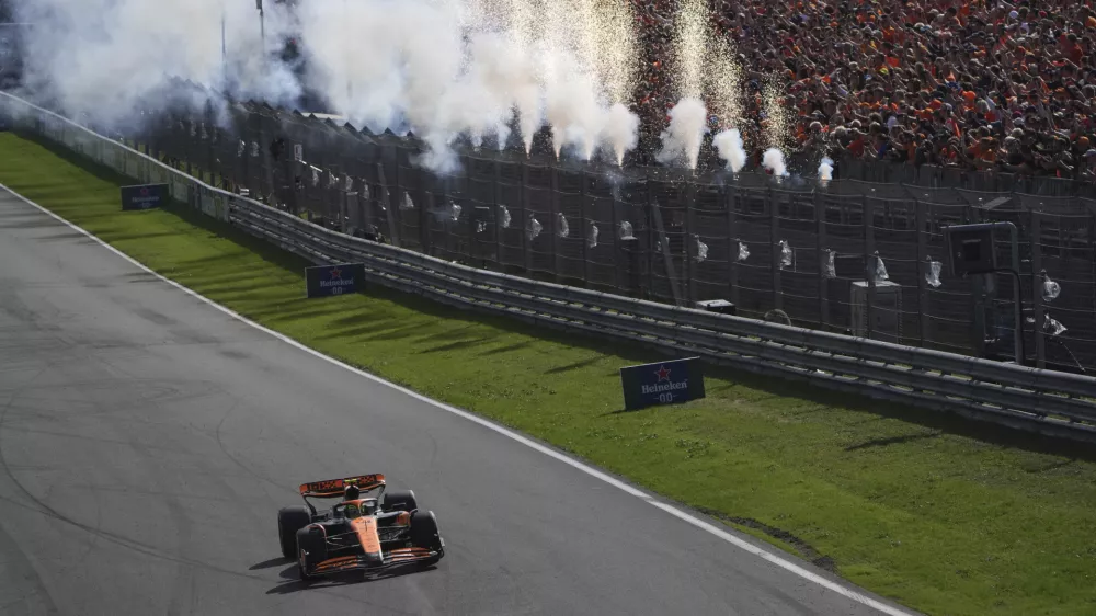 McLaren driver Lando Norris of Britain steers his car to win the Formula One Dutch Grand Prix race at the Zandvoort racetrack, Netherlands, Sunday, Aug. 25, 2024. (AP Photo/Patrick Post, Pool)